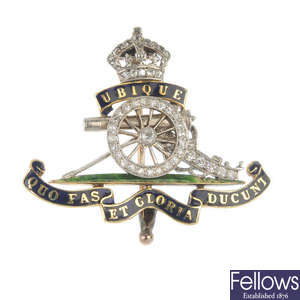 An early 20th century platinum and 18ct gold enamel and diamond Royal Artillery brooch.