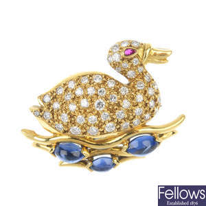 An 18ct gold diamond, sapphire and ruby duck brooch.