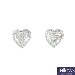 A pair of diamond single-stone ear studs. 
