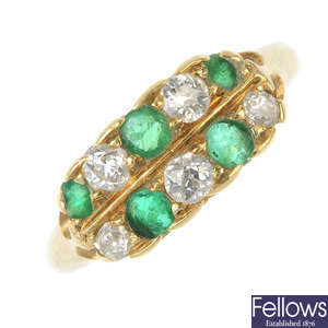 A mid 20th century 18ct gold diamond and emerald two-row ring. 