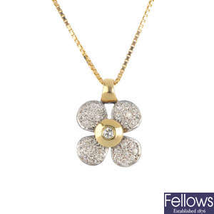 A diamond floral pendant.