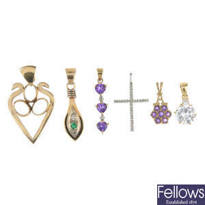 A selection of six gem-set pendants.