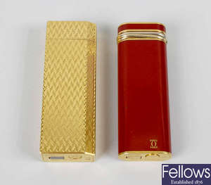 Two Cartier lighters