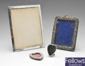 Four silver mounted photograph frames. 