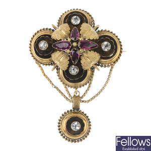 A mid 19th century gold, garnet and paste brooch.