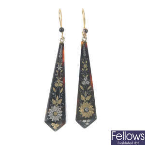 A pair of late 19th century pique tortoiseshell ear pendants. 