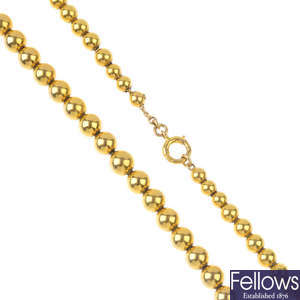 A late 19th century 9ct gold bead necklace and bracelet. 