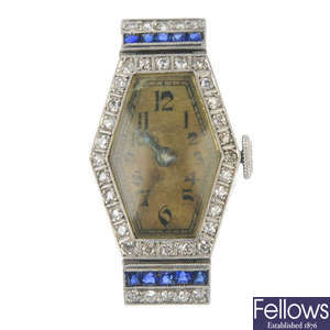 An early 20th century diamond and sapphire cocktail watch head.  