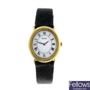 PIAGET - a lady's yellow metal wrist watch.