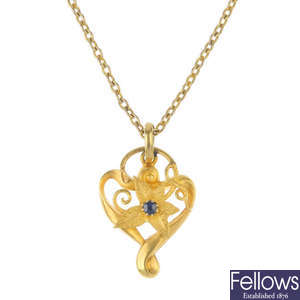 An Edwardian 15ct gold sapphire floral pendant.