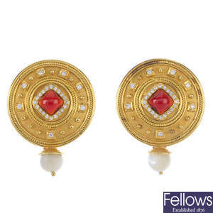 A pair of garnet, diamond and mother of pearl earrings.