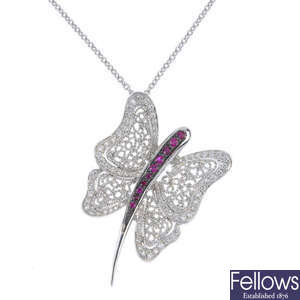 A ruby and diamond butterfly pendant.