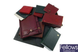 A selection of Rolex branded wallets, pads and document folder.