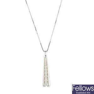An 18ct gold diamond pendant, with chain.