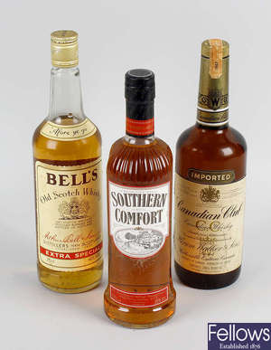 A box containing a mixed selection of Whisky and related spirits