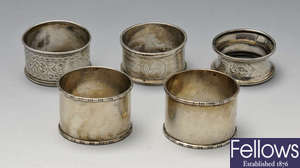 A small selection of various silver napkin rings. 