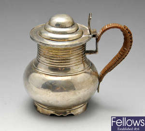 A late Victorian silver hot milk jug. 