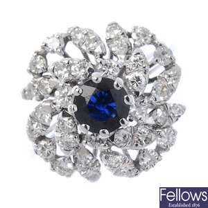A sapphire and diamond floral dress ring.