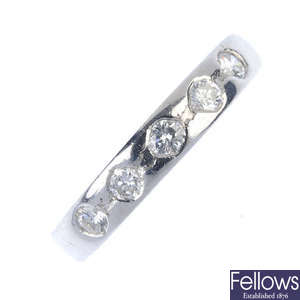 A platinum diamond band ring. 