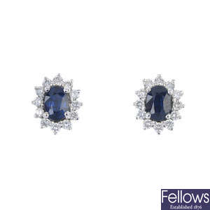 A sapphire and diamond cluster pendant and ear stud set. 