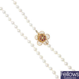 A cultured pearl, ruby and diamond single-strand necklace.
