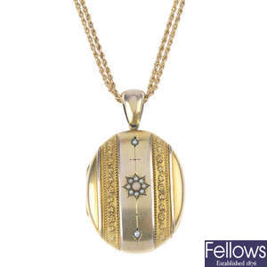 An early 20th century gold locket, with chain. 