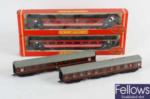  A box containing a good mixed selection of model railway carriages and rolling stock