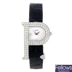 PIAGET - a lady's factory diamond set 18ct white gold wrist watch.