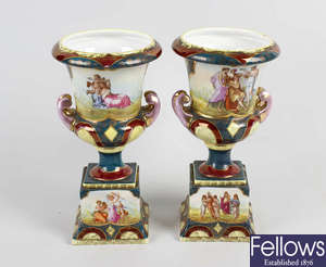 A pair of Vienna porcelain urns. 