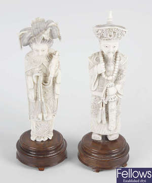  A pair of carved ivory figures