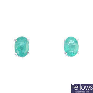 A pair of emerald ear-studs and an emerald necklace.