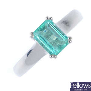 An emerald single-stone ring. 