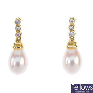 A pair of 18ct gold cultured pearl and diamond ear pendants.