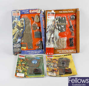  A box containing Palitoy Action Man items, including uniforms and instruction manuals and booklets 