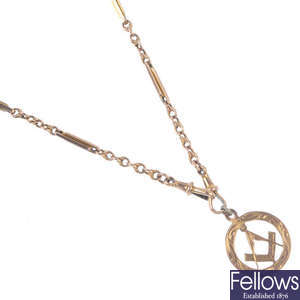 An early 20th century 9ct gold Albert chain and a Masonic pendant.