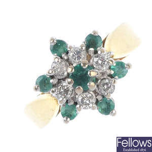 An 18ct gold emerald and diamond floral cluster ring.