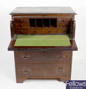 An early 19th century mahogany secretaire chest of drawers