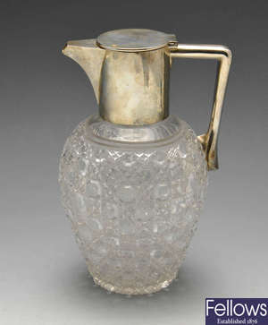 A late Victorian silver mounted glass claret jug. 