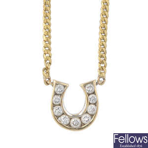 A diamond horseshoe necklace.