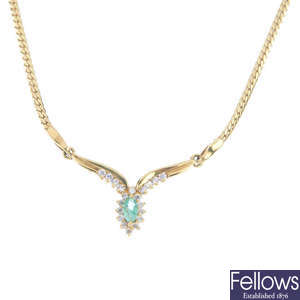 An emerald and cubic zirconia necklace.