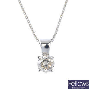 A diamond single-stone pendant and chain.