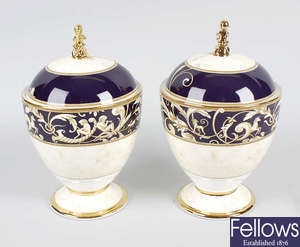 A pair of Wedgwood Cornucopia urns with covers