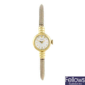 PIAGET - a lady's 18ct yellow gold bracelet watch.