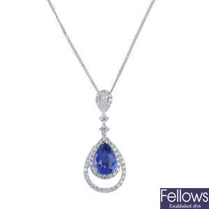 A sapphire and diamond pendant, with chain.