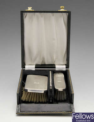 A small modern silver rose bowl, a cased pair of silver brushes & comb, etc.