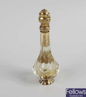  An unusual 19th century French yellow metal mounted glass scent bottle