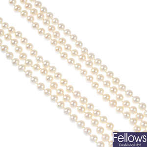 A cultured pearl three-row necklace.