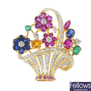 A diamond and gem-set floral brooch. 