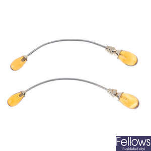 EMPORIO ARMANI - a pair of modified amber ear pendants.