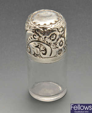 A late Victorian silver mounted glass scent bottle, etc.  